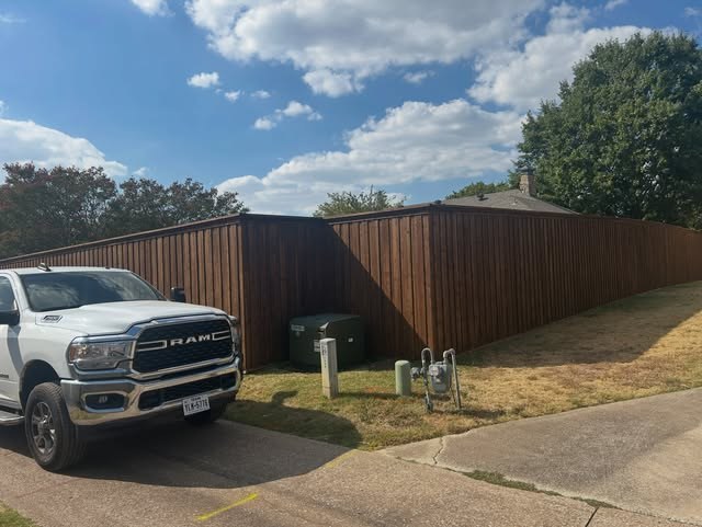 320 linear feet of eight-foot privacy fence with an electric driveway gate.