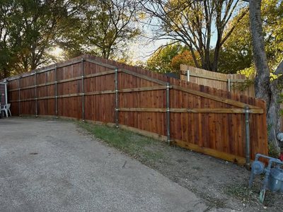 Custom fence on sloped terrain
